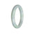 A round jadeite bangle bracelet in untreated green with lavender hues, showcasing the natural beauty of the stone.