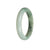 A white and green traditional jade bangle bracelet, certified as natural, with a half moon shape measuring 57mm.