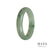 A half moon shaped traditional jade bangle with a genuine grade A green hue, measuring 59mm in diameter. Sold by MAYS.