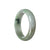 A lavender-colored bangle made with Grade A green Jade, in a unique half-moon shape, measuring 59mm in diameter. Designed by MAYS™.