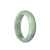 A high-quality green and lavender traditional jade bangle in a half-moon shape, perfect for adding a touch of elegance to any outfit.