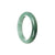 A close-up image of a Real Grade A Bluish green Jadeite Jade Bracelet. The bracelet features a half-moon shape and measures approximately 51mm. Designed by MAYS™.