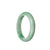 An elegant and beautiful white jadeite bangle bracelet with a half moon shape, featuring a stunning apple green color. The perfect accessory to add a touch of sophistication to any outfit.