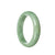 A close-up image of a green Burma Jade bangle bracelet with a half-moon shape, measuring 59mm in diameter. The bracelet is certified as Type A Jade and is from the MAYS™ collection.