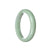 A light green Burmese jade bangle with a half moon shape, 60mm in size, certified as Type A. Sold by MAYS.