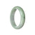 An elegant, certified Grade A pale green bangle made from lavender Burma Jade. This 59mm half moon-shaped accessory from MAYS GEMS is a stunning piece of jewelry.