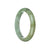A light green Burmese jade bangle bracelet, certified Grade A. The bracelet is semi-round and measures 61mm in diameter. Sold by MAYS.