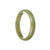A beautiful, high-quality jade bracelet in a brownish olive green color. It features a half-moon design and is certified as Grade A. Perfect for adding a touch of elegance to any outfit.