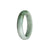 A stunning certified Type A white Burmese jade bracelet, featuring a 54mm half moon design with beautiful green and grey hues. Crafted with precision and quality by MAYS™.