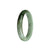 An elegant, Grade A grey with olive green Burma Jade bracelet in a unique 58mm half moon shape.