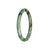A beautiful jade bracelet with a green and brown pattern, featuring a petite round shape measuring 60mm. Made with genuine Grade A jade, this traditional bracelet is a stunning accessory to add to your collection.
