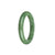 A close-up image of a beautiful jade bracelet made from untreated green Burma jade. The bracelet is semi-round in shape and measures 53mm in size. It is a genuine piece of jade, known for its stunning natural green color. The bracelet is a product of MAYS™, a reputable brand in the jewelry industry.