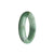 A close-up image of a beautiful green and white jade bangle with a unique half moon pattern. The bangle is made of genuine natural jadeite jade and measures 54mm in diameter. It is a stunning piece of jewelry from the brand MAYS.