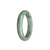 A half-moon shaped certified natural whitish grey jadeite bangle with stunning green and yellow hues - 55mm in size. Expertly crafted by MAYS™.