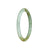 A small, round white and green jadeite jade bracelet, certified as Type A.