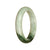 A pale green and green Burma jade bangle bracelet with a half moon shape, measuring 52mm. Certified as Type A jade.