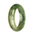 A half-moon shaped, Grade A Green Pattern Jade Bangle, certified as high quality by MAYS™.