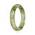 A half moon-shaped traditional jade bangle with a white and green pattern, made from genuine Grade A jade.