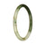 A delicate round jadeite jade bangle bracelet with a beautiful green and white pattern.