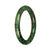 A half moon-shaped bangle bracelet made of certified, untreated deep green pattern jadeite.