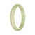 A light green traditional jade bangle in the shape of a half moon, measuring 57mm in diameter. It is made of high-quality jade and has a smooth, polished surface. The bangle is from the brand MAYS, known for their authentic and beautifully crafted jade jewelry.