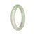 An elegant white and light green jade bracelet with a traditional design, measuring 53mm in diameter.