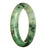 A close-up image of a beautiful jade bracelet, featuring a pattern of green and white colors. The bracelet is in the shape of a 63mm half moon, and it is made of high-quality Grade A jade. The bracelet is being sold by MAYS.