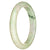 A beautiful white jade bangle with a traditional pattern, featuring a half moon design.