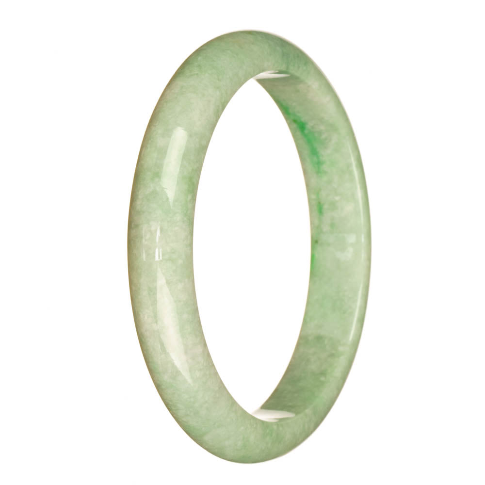 A close-up image of a pale green jadeite jade bracelet, shaped like a half moon. The bracelet has a smooth surface and is made of genuine untreated jade. It features a beautiful emerald green color, reflecting the light. The bracelet measures 78mm in size and is a stunning piece of jewelry offered by Mays Gems.