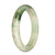 A beautiful half moon-shaped white and green patterned jadeite bangle bracelet, untreated and genuine.