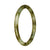 Close-up image of a beautiful jade bangle with a green, white, and brown pattern. The bangle is petite and round, measuring 62mm in size. Brand name MAYS™ is visible.