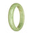 An elegant light green jade bracelet with a half moon shape, measuring 58mm. This bracelet is made of certified Grade A jade and is created by MAYS.