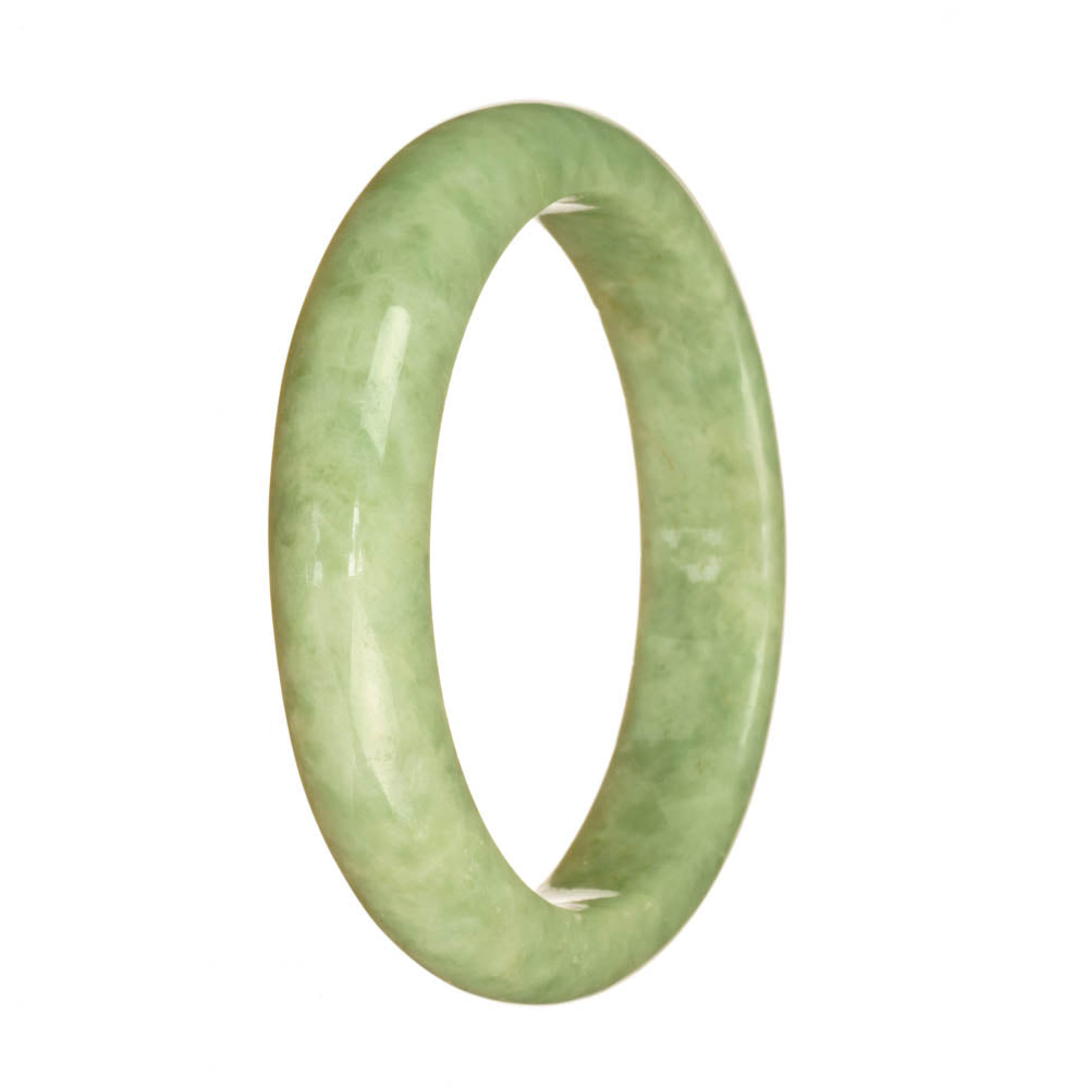 A close-up photo of a half moon-shaped bracelet made of certified natural light green jadeite. The bracelet is 58mm in size and is offered by MAYS GEMS.