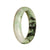A stunning half moon shaped Burmese Jade bangle with a beautiful white and green pattern. Perfect for adding a touch of elegance and natural beauty to your ensemble.