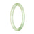A beautiful light green jade bangle bracelet, in a petite round shape with a diameter of 60mm, showcasing the traditional and genuine Type A jade.