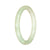 A dainty round light green jadeite bracelet with a 55mm circumference, untreated and made with genuine jade.