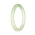 A close-up of a delicate light green jade bracelet, crafted in a traditional style. The bracelet has a petite round shape, measuring 55mm in diameter. The jade is genuine and untreated, showcasing its natural beauty. Designed by MAYS™.