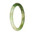 A beautiful light green and green patterned jade bracelet, featuring a petite round shape measuring 58mm. This bracelet is made with genuine Type A jade and is brought to you by MAYS™.