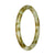 A small round Burmese jade bangle with a beautiful brown and pale green pattern. Certified Grade A. Perfect for petite wrists measuring 60mm in diameter. Sold by MAYS GEMS.