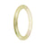 A dainty, round jadeite bracelet with a beautiful light green and green pattern.