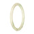 A close-up photo of a small, round light green Burmese jade bangle with a smooth, polished surface, measuring 60mm in diameter.