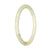 A light green Burma jade bangle bracelet, petite in size with a 60mm round shape. Expertly crafted and made from genuine Type A jade. Perfect for adding a touch of elegance to any outfit.