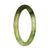 A close-up image of a petite round jadeite bracelet with a green pattern. The bracelet is made with genuine Grade A jadeite and has a diameter of 59mm. It is a product from MAYS™.