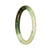 A small round jade bracelet with a beautiful white and green pattern.
