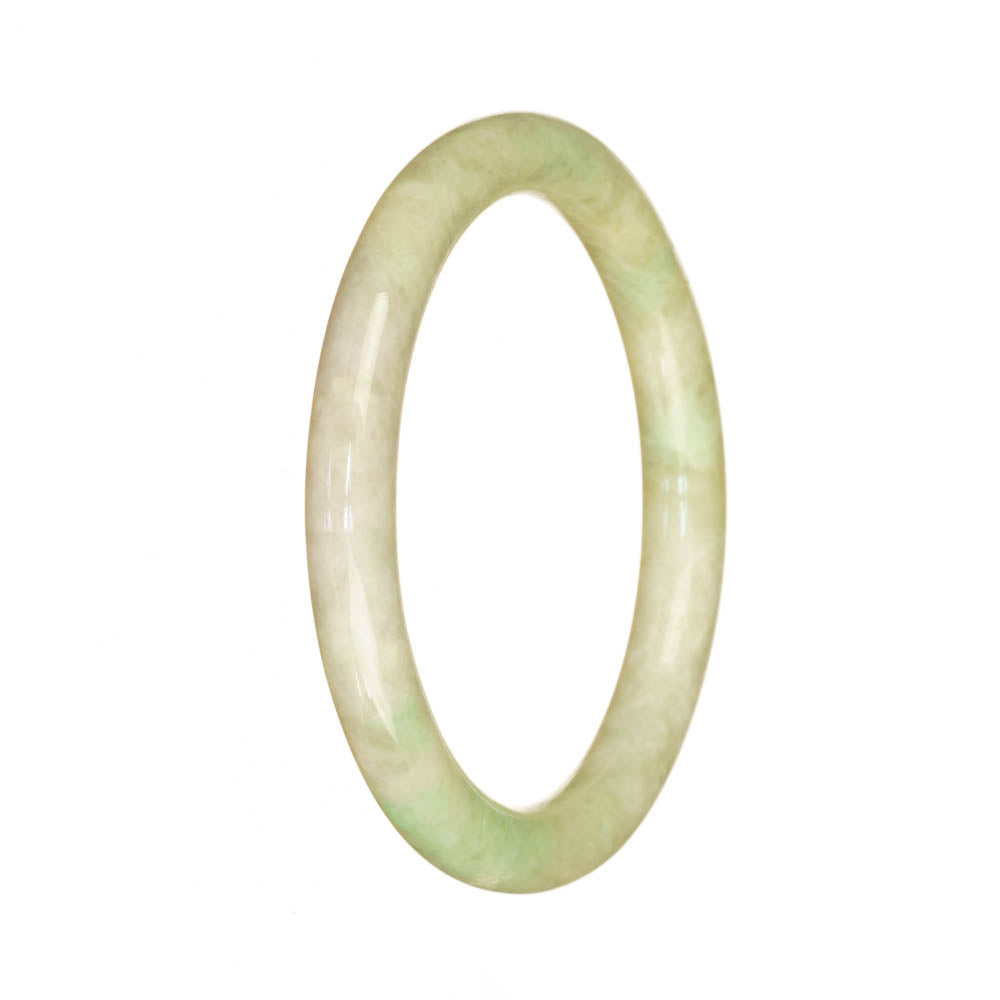 A small round pale green jadeite bangle bracelet, featuring an authentic and natural design.