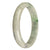A beautiful jade bracelet with a half moon shape and a white base color adorned with green patterns, apple green spots, and lavender spots. Made of genuine grade A Burma jade. Perfect for adding a touch of natural elegance to any outfit.