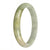 A stunning Burmese jade bangle bracelet with natural green color, adorned with yellow and grey patches. This 77mm half moon-shaped bracelet is a genuine and exquisite piece from MAYS.
