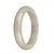 Close-up image of a lavender-colored jade bangle with a smooth, half-moon shape. The bangle is made from genuine, natural jade and has a diameter of 60mm. The brand name "MAYS" is engraved on the inner side of the bangle.