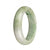 A beautiful half-moon shaped green and lavender Burma Jade bangle bracelet, certified as Grade A.