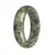A grey jade bangle with a traditional pattern, 59mm in size, shaped like a half moon.